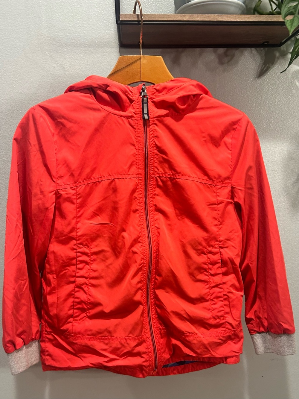 Unisex Mini Boden Bright Red Hooded Kids Raincoat with blue camo cotton lining